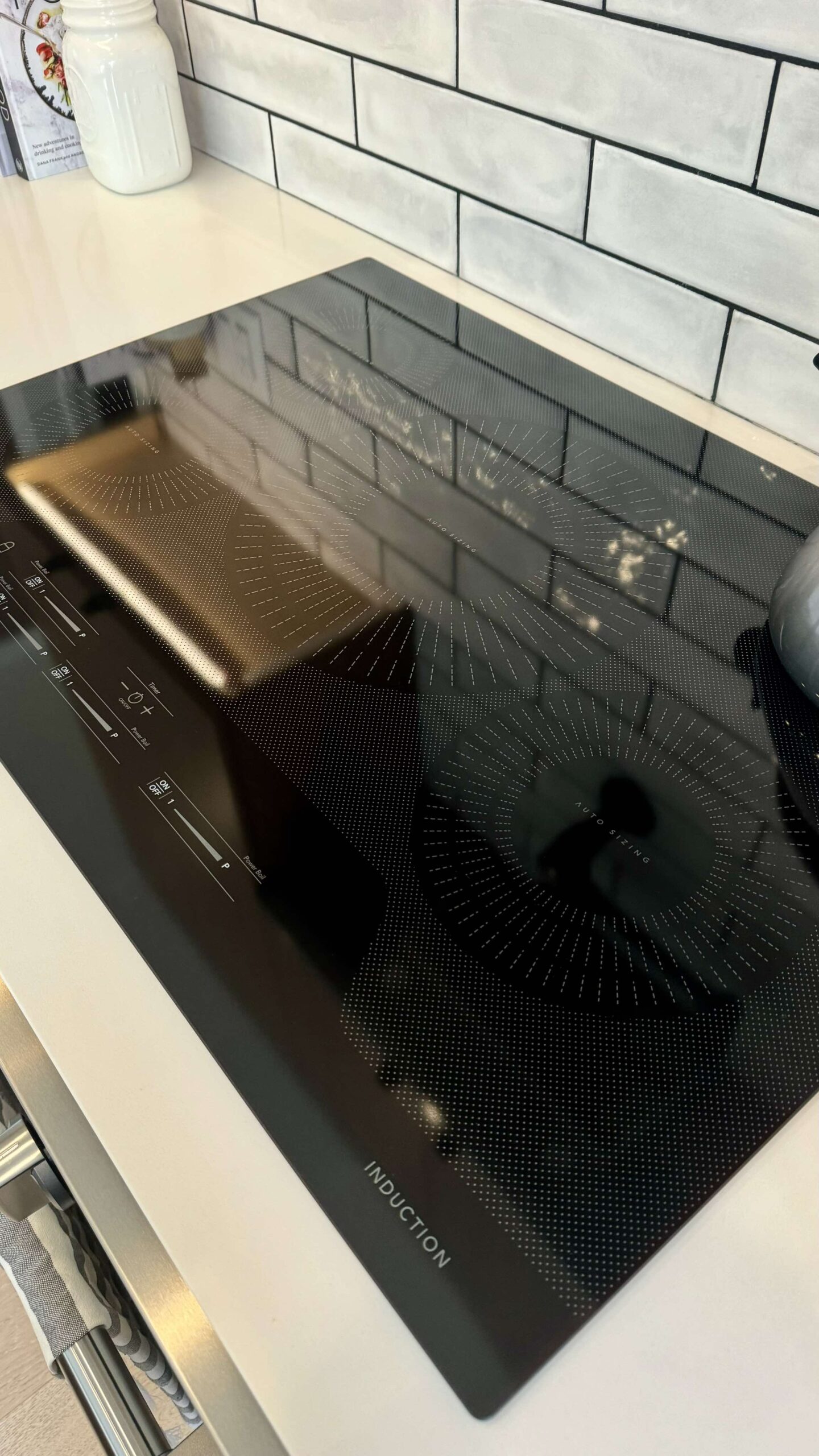 Post-construction cleaning — glass cooktop polished after