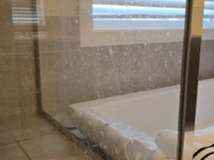 Glass shower door before — Art of CleaNest Edmonton