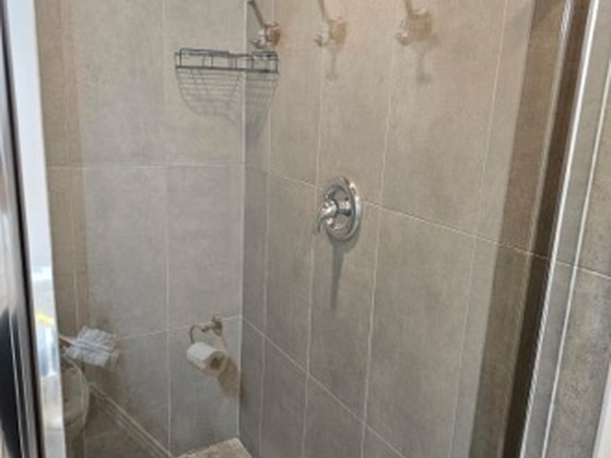 Tiled walk-in shower after — Art of CleaNest Edmonton